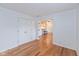 Spacious living room with hardwood floors and open doorway to the kitchen at 12290 Charing Cross Rd, Carmel, IN 46033