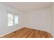 Home office with hardwood floors and a large window at 12290 Charing Cross Rd, Carmel, IN 46033