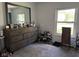 Bedroom with a wooden dresser and ample natural light from the windows at 128 Coronado Rd, Indianapolis, IN 46234