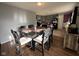 The dining room has a full dining set and is connected to the kitchen at 128 Coronado Rd, Indianapolis, IN 46234