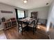 Cozy dining room with wood floors, a spacious table, and a charming coffee bar area at 128 Coronado Rd, Indianapolis, IN 46234