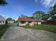 View of exterior and long driveway leading to the cozy home at 128 Coronado Rd, Indianapolis, IN 46234