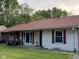 Charming home exterior displaying the chairs on the front porch at 128 Coronado Rd, Indianapolis, IN 46234