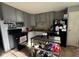 Functional kitchen with updated appliances, gray cabinetry, and ample storage space at 128 Coronado Rd, Indianapolis, IN 46234