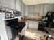 Efficient kitchen featuring updated appliances, gray cabinetry, and a functional layout at 128 Coronado Rd, Indianapolis, IN 46234