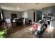 Open kitchen with wood flooring, gray cabinets and a mobile kitchen island at 128 Coronado Rd, Indianapolis, IN 46234