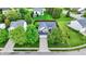 Beautiful aerial view of a home, showcasing the landscaped yard, mature trees, and neighborhood setting at 13209 Westwood Ln, Fishers, IN 46038