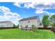 Well-manicured lawn with a cozy deck and a privacy fence, creating a perfect outdoor oasis at 13209 Westwood Ln, Fishers, IN 46038
