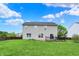 Expansive backyard with a well-kept lawn and a private deck, ideal for outdoor enjoyment at 13209 Westwood Ln, Fishers, IN 46038