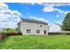 Lush green backyard features a cozy deck and a sturdy privacy fence, ideal for outdoor activities at 13209 Westwood Ln, Fishers, IN 46038