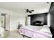 Spacious bedroom featuring a ceiling fan and an open doorway at 13209 Westwood Ln, Fishers, IN 46038