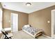 Well-lit bedroom featuring a bed and doorway at 13209 Westwood Ln, Fishers, IN 46038