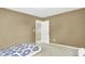 Bedroom featuring a bed and doorway to hallway at 13209 Westwood Ln, Fishers, IN 46038