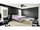 Bedroom with black walls, neutral carpet and two windows at 13209 Westwood Ln, Fishers, IN 46038