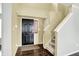 Bright foyer featuring hardwood floors, staircase and a stylish front door at 13209 Westwood Ln, Fishers, IN 46038
