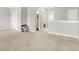Upstairs hallway with neutral carpet and wall colors, doors leading to bedrooms and baths, and natural light at 13209 Westwood Ln, Fishers, IN 46038
