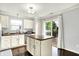 Bright kitchen features a center island, white cabinets, and modern appliances at 13209 Westwood Ln, Fishers, IN 46038