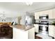 Open kitchen with stainless appliances and an eat-in kitchen island at 13209 Westwood Ln, Fishers, IN 46038