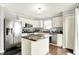 Updated kitchen features stainless appliances, a center island and ample counter space at 13209 Westwood Ln, Fishers, IN 46038