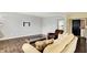 Bright living room featuring hardwood floors, neutral paint, and a modern television mount at 13209 Westwood Ln, Fishers, IN 46038