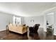 Inviting living room featuring hardwood floors, neutral paint, and ample natural light at 13209 Westwood Ln, Fishers, IN 46038