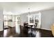 Spacious living room and open floor plan, wood floors, and bright lighting at 13209 Westwood Ln, Fishers, IN 46038