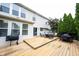 Large backyard deck with outdoor seating and mature landscaping, great for entertaining and relaxing outdoors at 14030 Avalon East Dr, Fishers, IN 46037