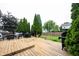 Spacious wooden deck features outdoor seating, a grill, and lovely landscaping for outdoor entertaining at 14030 Avalon East Dr, Fishers, IN 46037