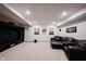 Finished basement with a plush leather sofa, home theater setup, and recessed lighting at 14030 Avalon East Dr, Fishers, IN 46037