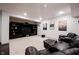 Finished basement with a dark entertainment center, a luxurious leather sofa, and recessed lighting at 14030 Avalon East Dr, Fishers, IN 46037
