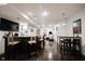 Basement bar area featuring a modern counter, bar stools, and a TV for entertainment at 14030 Avalon East Dr, Fishers, IN 46037