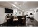 Well-lit basement bar area with ample seating and modern finishes at 14030 Avalon East Dr, Fishers, IN 46037