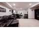 Extensive basement featuring a lounge area, a bar setup, and workout space at 14030 Avalon East Dr, Fishers, IN 46037