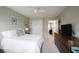Cozy bedroom with white bedding, a ceiling fan, and neutral walls, creating a serene atmosphere at 14030 Avalon East Dr, Fishers, IN 46037