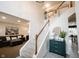 Open concept foyer with staircase, stylish console table, and views into the living and dining areas at 14030 Avalon East Dr, Fishers, IN 46037