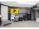 Organized garage with ample storage cabinets, a utility sink, and a durable epoxy floor, perfect for projects at 14030 Avalon East Dr, Fishers, IN 46037