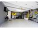 Spacious garage features epoxy floors, organized storage, and ample workspace for projects and parking at 14030 Avalon East Dr, Fishers, IN 46037
