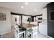 Bright kitchen with white cabinetry and countertops, island, stainless steel appliances, and hardwood floors at 14030 Avalon East Dr, Fishers, IN 46037