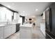 Bright kitchen featuring a central island, stainless steel appliances, sleek countertops, and backyard views at 14030 Avalon East Dr, Fishers, IN 46037