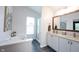 Bright main bathroom with dual vanity, bathtub, walk-in shower, and tile flooring at 14030 Avalon East Dr, Fishers, IN 46037