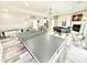Spacious finished basement area includes ping pong table, pool table, fireplace, and bar area for entertaining at 14035 Stone Key Way, Fishers, IN 46037