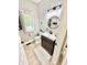 Stylish powder room featuring a modern vanity, decorative wall treatments and a patterned accent wall at 14035 Stone Key Way, Fishers, IN 46037