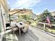 Outdoor dining area with an umbrella overlooking the beautiful canal at 14035 Stone Key Way, Fishers, IN 46037