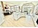 Bright and spacious kitchen features white cabinets, an island with bar seating, and an open layout to the living spaces at 14035 Stone Key Way, Fishers, IN 46037