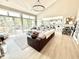 Open-concept living area boasts a wall of sliding glass doors, a gourmet kitchen and a comfortable seating area at 14035 Stone Key Way, Fishers, IN 46037
