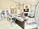 Expansive living room featuring a fireplace, open access to the dining area and tall ceilings at 14035 Stone Key Way, Fishers, IN 46037