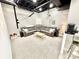 Finished basement with a theater and comfortable seating area featuring a large sectional, projector, and carpeted floors at 14035 Stone Key Way, Fishers, IN 46037