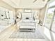 An elegant main bedroom suite with ensuite bathroom access and a neutral color palette at 14035 Stone Key Way, Fishers, IN 46037
