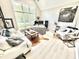 Well-lit office with a large window, modern furnishings, a vaulted ceiling and hardwood style flooring at 14035 Stone Key Way, Fishers, IN 46037