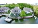 Waterfront property with lush landscaping, private dock, and serene water views at 14035 Stone Key Way, Fishers, IN 46040